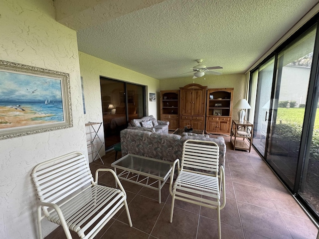 sunroom / solarium with ceiling fan