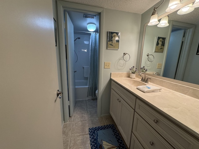 full bathroom with tile patterned flooring, toilet, a textured ceiling, shower / bath combination with curtain, and vanity