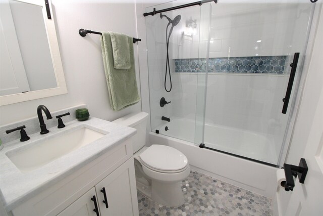 24 Aledo Ct, Saint Augustine, FL 32086 - bathroom with shower / bath combination with glass door, vanity, and toilet