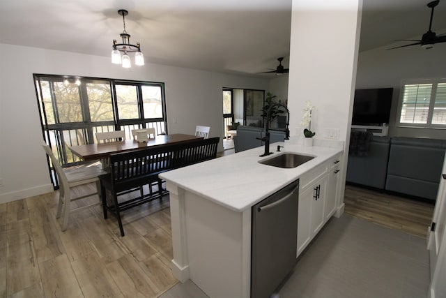 24 Aledo Ct, Saint Augustine, FL 32086 - kitchen featuring open floor plan, white cabinets, a sink, light wood-type flooring, and dishwasher