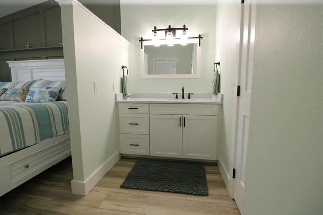 24 Aledo Ct, Saint Augustine, FL 32086 - bathroom featuring wood finished floors, vanity, and baseboards