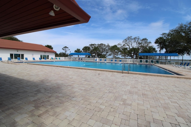 24 Aledo Ct, Saint Augustine, FL 32086 - community pool featuring a patio and fence