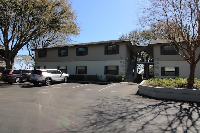 24 Aledo Ct, Saint Augustine, FL 32086 - view of property featuring stairs and uncovered parking