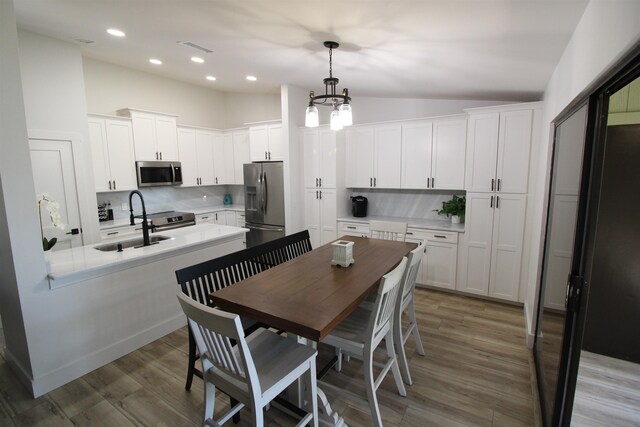 24 Aledo Ct, Saint Augustine, FL 32086 - kitchen featuring light countertops, appliances with stainless steel finishes, backsplash, and white cabinets
