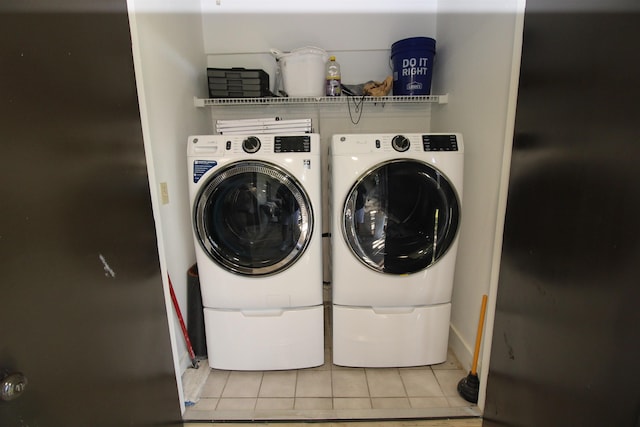 24 Aledo Ct, Saint Augustine, FL 32086 - laundry room featuring washing machine and dryer, laundry area, and tile patterned floors