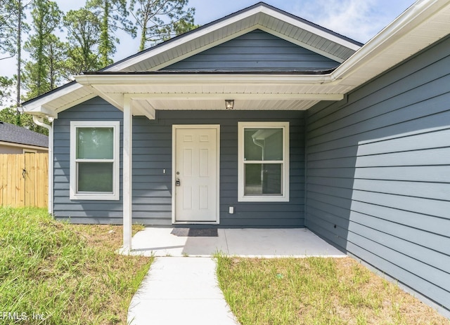 property entrance featuring covered porch