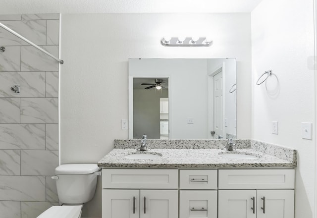 bathroom featuring ceiling fan, vanity, and toilet