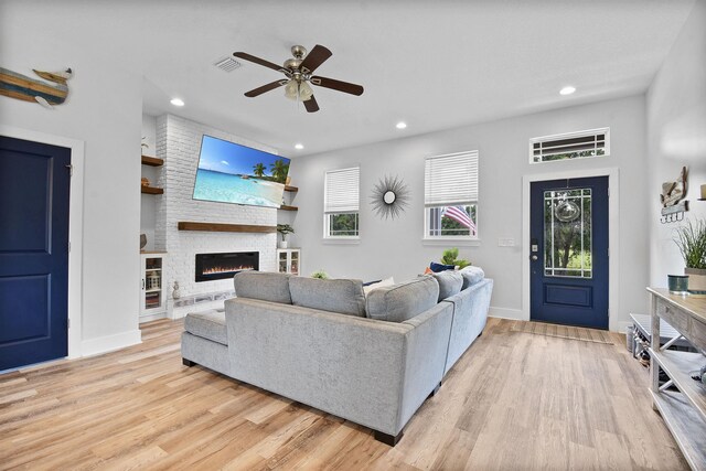 13 Court Edna, Saint Augustine, FL 32084 - living area with light wood-style flooring, a large fireplace, recessed lighting, ceiling fan, and baseboards