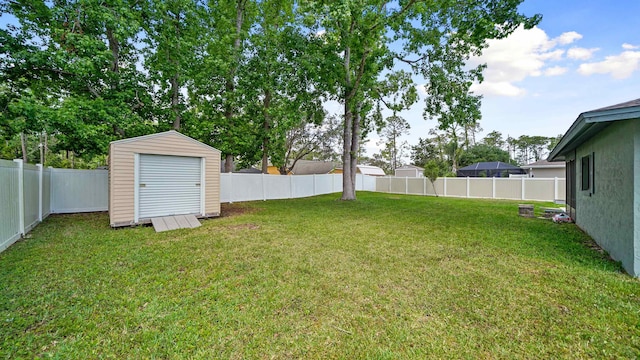 90 Wellshire Ln, Palm Coast, FL 32164 - view of yard featuring a fenced backyard, a storage unit, and an outbuilding