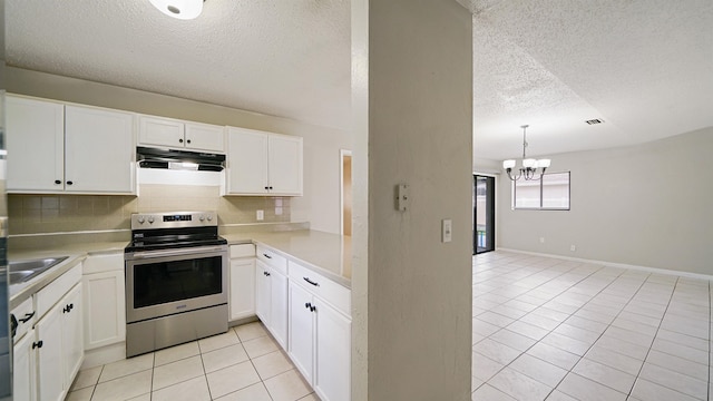 90 Wellshire Ln, Palm Coast, FL 32164 - kitchen with decorative backsplash, light tile patterned flooring, a textured ceiling, stainless steel electric range, and under cabinet range hood