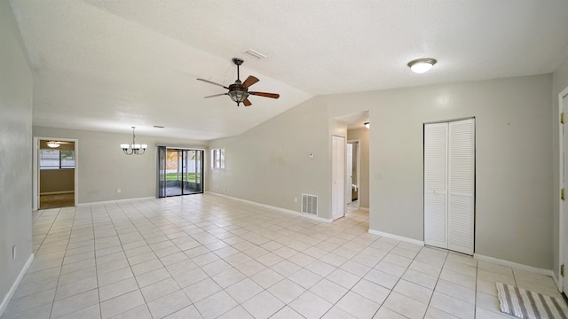 90 Wellshire Ln, Palm Coast, FL 32164 - spare room with vaulted ceiling, a wealth of natural light, ceiling fan with notable chandelier, and visible vents