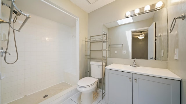 90 Wellshire Ln, Palm Coast, FL 32164 - full bathroom with ceiling fan, a tile shower, tile patterned floors, vanity, and toilet