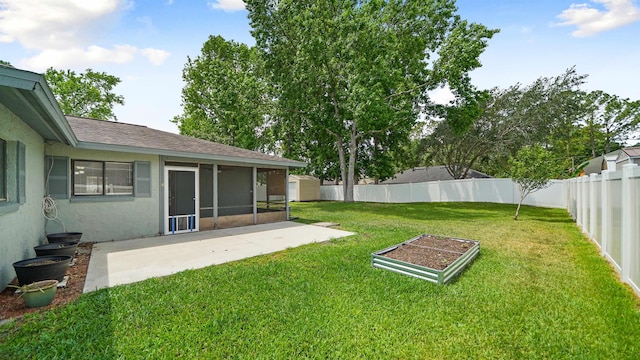 90 Wellshire Ln, Palm Coast, FL 32164 - view of yard with a vegetable garden, a fenced backyard, a sunroom, and a patio area