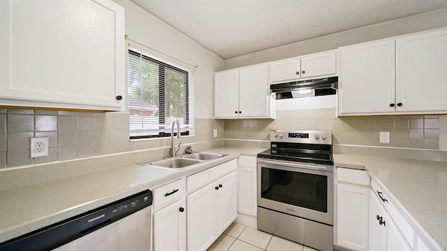90 Wellshire Ln, Palm Coast, FL 32164 - kitchen with a sink, white cabinets, stainless steel appliances, and under cabinet range hood