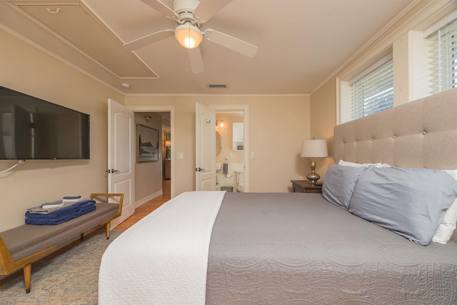 bedroom featuring ornamental molding, connected bathroom, and ceiling fan