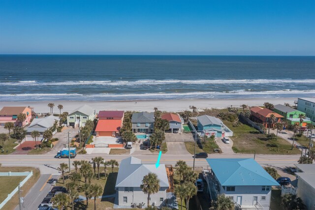 aerial view featuring a water view and a beach view