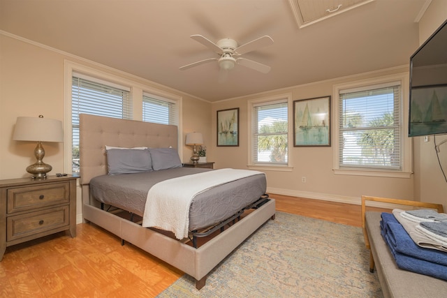 bedroom with crown molding, ceiling fan, and light wood-type flooring