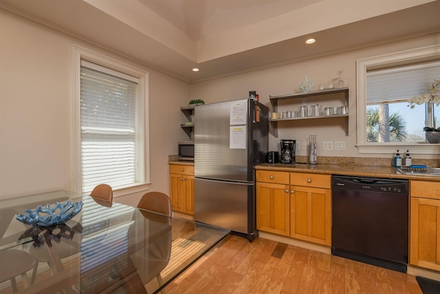 kitchen featuring stainless steel appliances and light hardwood / wood-style floors