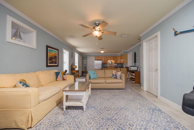 living room featuring light tile patterned floors, crown molding, and ceiling fan