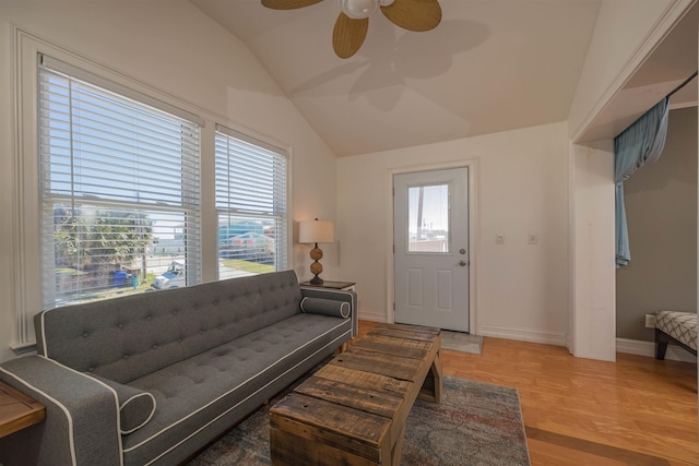 living room featuring vaulted ceiling, a healthy amount of sunlight, hardwood / wood-style floors, and ceiling fan