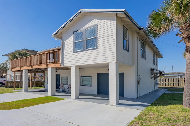 back of property featuring a deck