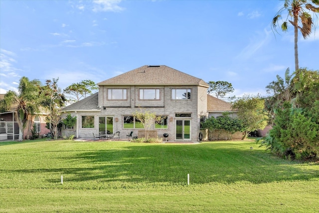 rear view of house with a lawn