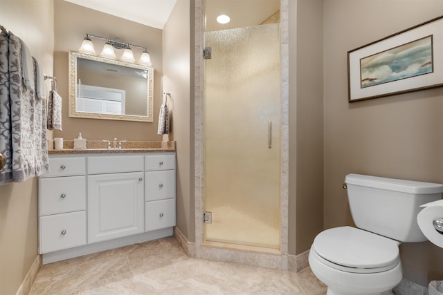 bathroom with baseboards, a shower stall, toilet, and vanity