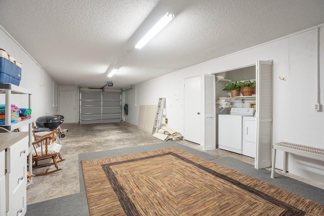 garage featuring washing machine and dryer