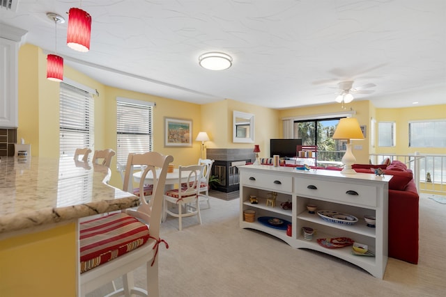 recreation room featuring a ceiling fan and light carpet