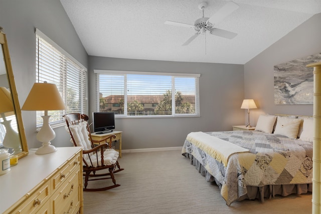 bedroom with vaulted ceiling, multiple windows, and light carpet