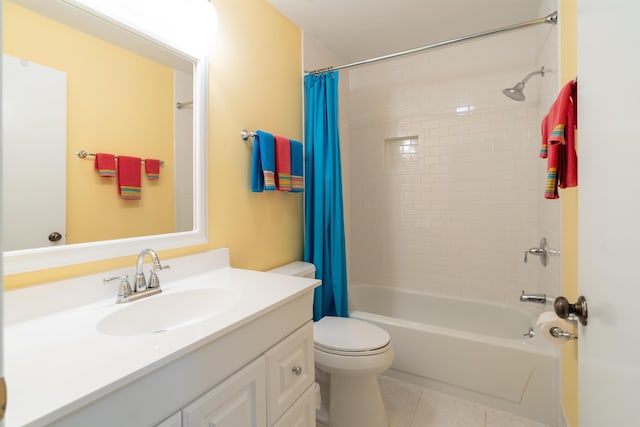 bathroom featuring shower / tub combo with curtain, vanity, toilet, and tile patterned floors