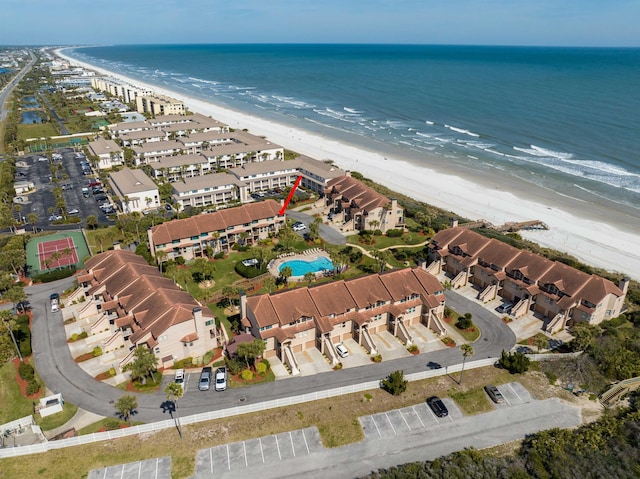 bird's eye view featuring a water view, a residential view, and a view of the beach