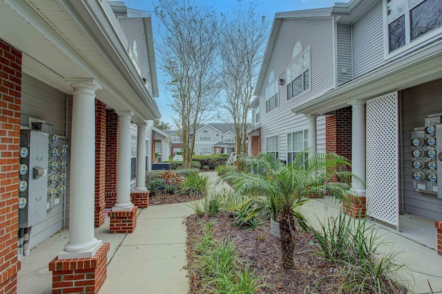 view of yard featuring a residential view and a porch