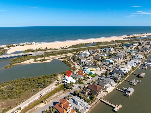 bird's eye view with a beach view and a water view