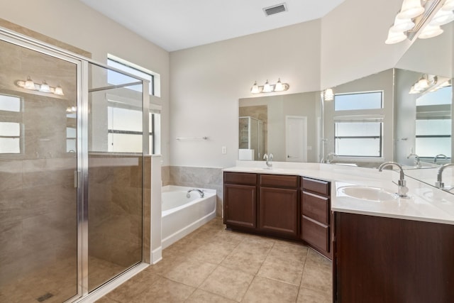153 Savanna Preserve Ct, Saint Augustine, FL 32095 - full bath featuring double vanity, a shower stall, a bath, and tile patterned flooring