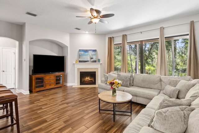 153 Savanna Preserve Ct, Saint Augustine, FL 32095 - living room with ceiling fan, wood finished floors, a tiled fireplace, and baseboards