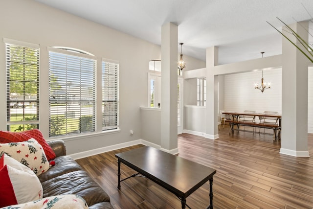153 Savanna Preserve Ct, Saint Augustine, FL 32095 - living room featuring a chandelier, healthy amount of natural light, baseboards, and wood finished floors