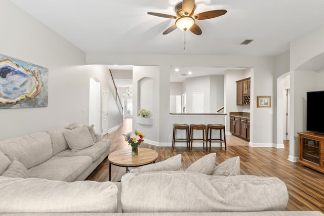 153 Savanna Preserve Ct, Saint Augustine, FL 32095 - living room with arched walkways, wood finished floors, a ceiling fan, and baseboards