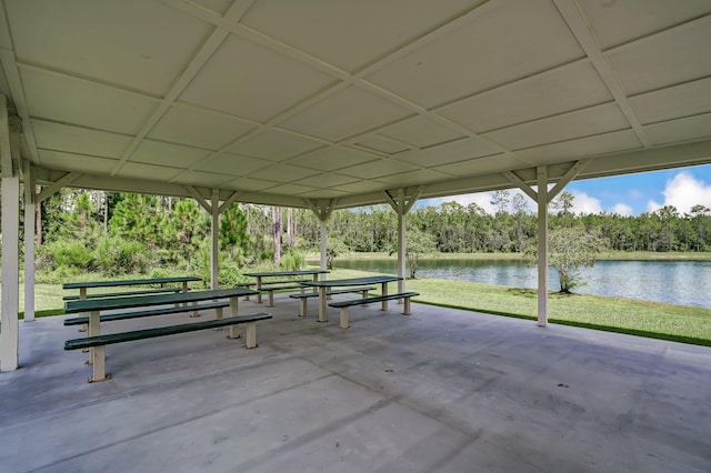 153 Savanna Preserve Ct, Saint Augustine, FL 32095 - view of property's community featuring a water view, a lawn, view of wooded area, and a patio