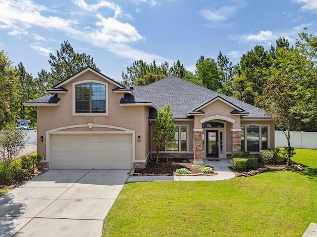 153 Savanna Preserve Ct, Saint Augustine, FL 32095 - view of front facade with stucco siding, stone siding, a garage, driveway, and a shingled roof