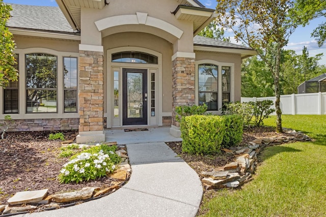 153 Savanna Preserve Ct, Saint Augustine, FL 32095 - property entrance featuring stone siding, stucco siding, and a shingled roof