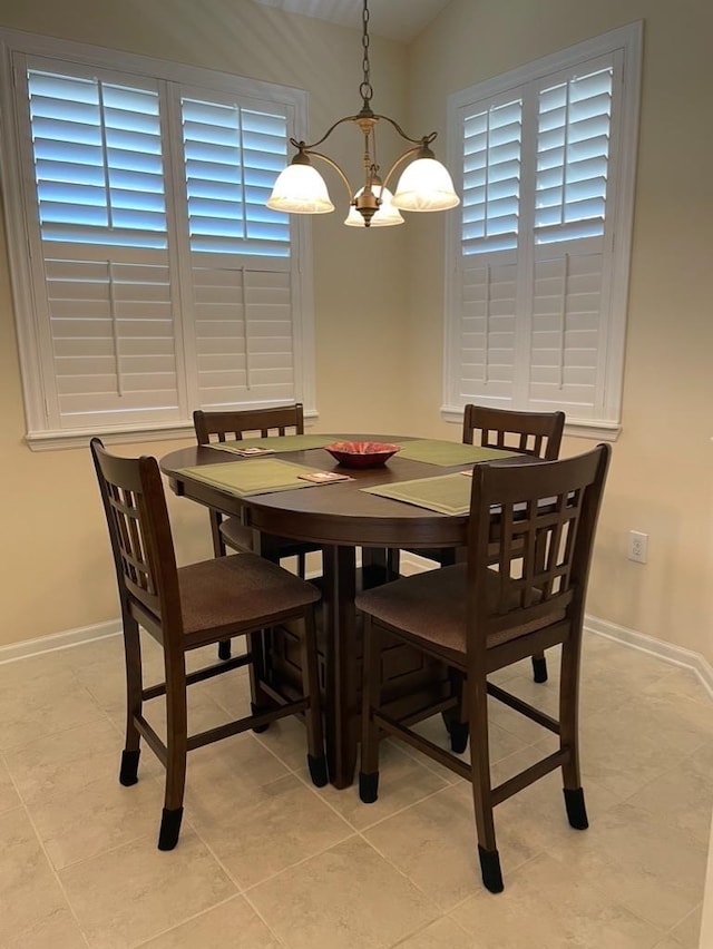 tiled dining area featuring plenty of natural light