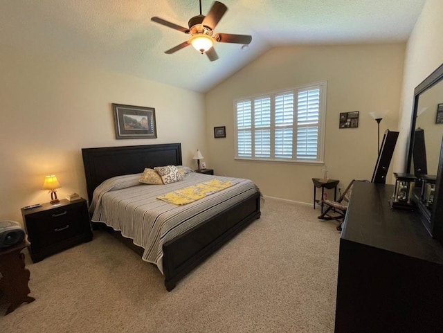 carpeted bedroom featuring lofted ceiling and ceiling fan