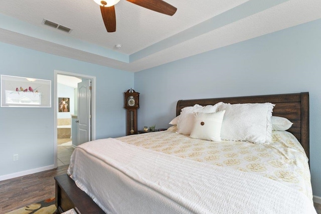 132 Fallen Timber Way, Saint Augustine, FL 32084 - bedroom featuring wood finished floors, ensuite bathroom, and a ceiling fan