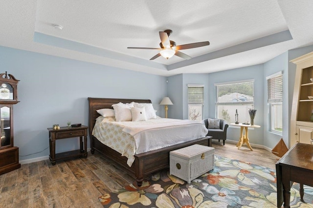 132 Fallen Timber Way, Saint Augustine, FL 32084 - bedroom featuring a tray ceiling, wood finished floors, and ceiling fan