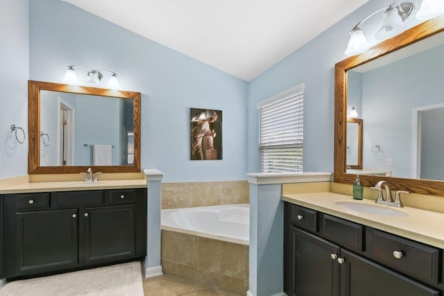 132 Fallen Timber Way, Saint Augustine, FL 32084 - full bath featuring vaulted ceiling, two vanities, a garden tub, and tile patterned floors