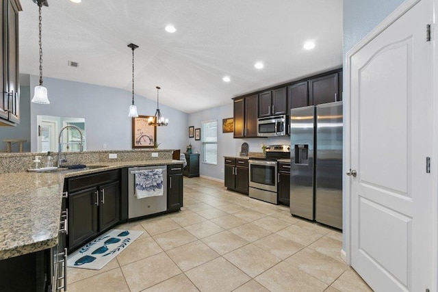 132 Fallen Timber Way, Saint Augustine, FL 32084 - kitchen featuring stainless steel appliances, lofted ceiling, a chandelier, hanging light fixtures, and a peninsula