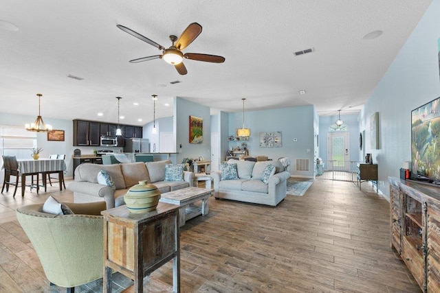 132 Fallen Timber Way, Saint Augustine, FL 32084 - living room with wood finished floors, ceiling fan, plenty of natural light, a textured ceiling, and recessed lighting