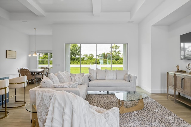 1 Clementon Ln, Palm Coast, FL 32137 - living area with beamed ceiling, light wood finished floors, and a chandelier