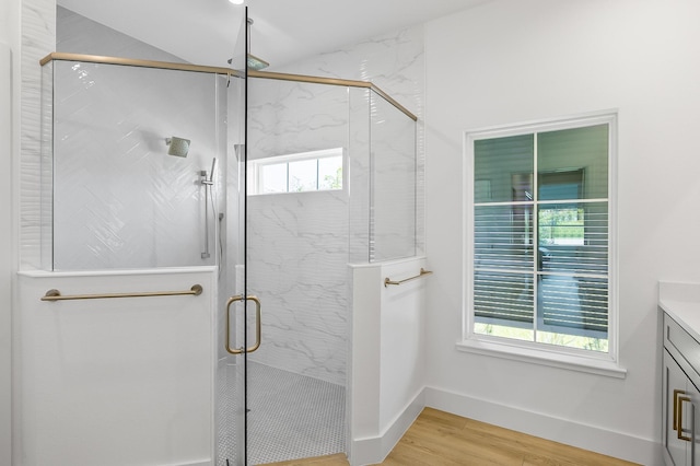 1 Clementon Ln, Palm Coast, FL 32137 - full bathroom with wood finished floors, vanity, and a marble finish shower
